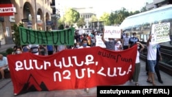 Environmental activists and residents of the resort town of Jermuk stage a protest in Yerevan against the construction of a gold mine at Amulsar in Vayots Dzor. August 20, 2020.