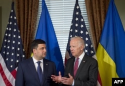U.S. Vice President Joe Biden (right) speaks with Ukrainian Prime Minister Volodymyr Hroysman during the latter's visit to Washington this week.