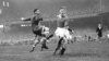 Chelsea's Reg Williams (right) rushes in to challenge Dynamo Moscow's Ivan Stankevich (left), deflecting the ball into the net for Chelsea's second goal, making the score 2-0.