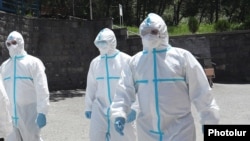 Armenia -- Healthcare workers wearing protective gear are seen outside the Nork Hospital for Infectious Diseases, Yerevan, June 5, 2020.