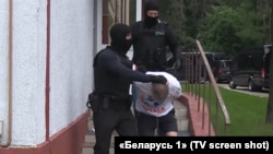A screenshot from Belarusian state TV showing the arrest of one of dozens of puported Russian mercenaries on July 29. 
