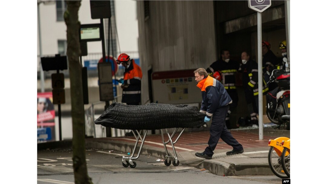 A medical worker removes a victim of the attacks outside the Maalbeek subway station on March 23.