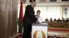Аляксандар Лукашэнка з сынам Колем падчас парлямэнцкіх выбараў на выбарчым участку ў Менску, 23 верасьня 2012 году 