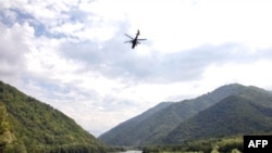 An Abkhaz helicopter flies over the remote Kodori Gorge near the town of Chkhalta