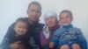Сагынбек Рахманов с супругой и двумя сыновьями.