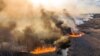 UKRAINE -- This picture taken on April 10, 2020, shows a field fire burning at a 30-kilometer (19-mile) Chernobyl exclusion zone, not far from the nuclear power plant. (Photo by Volodymyr Shuvayev / AFP)