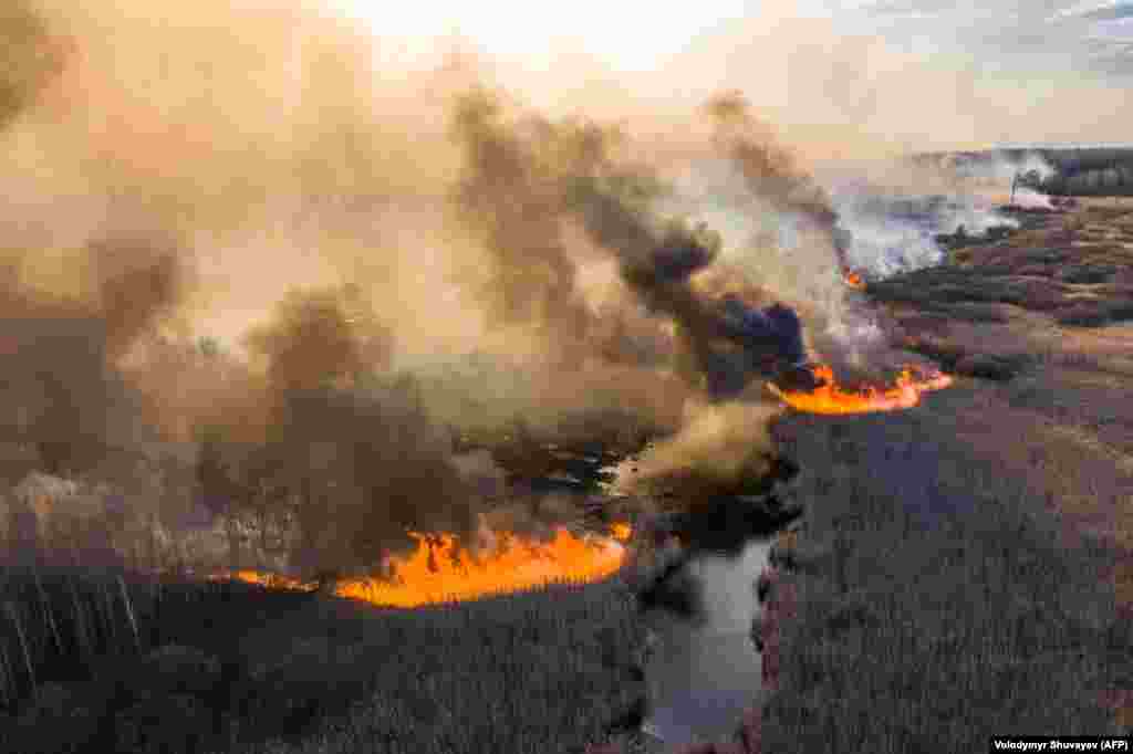 Wildfires burn in the 30-kilometer Chernobyl exclusion zone on April 10, not far from the defunct nuclear power plant. The acting director of Ukraine&#39;s State Ecology Inspection, Yehor Firsov, said on April 14 that firefighters had managed to finally extinguish the blaze.