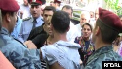 Armenia -- Police detain an opposition supporter near Yerevan's Liberty Square, 31May 2010.
