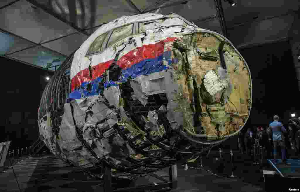 The reconstructed wreckage of Malaysia Airlines flight MH17 is seen after the presentation of the final report into the crash at the Gilze-Rijen Air Force base in the Netherlands. The plane was shot down over eastern Ukraine by a Russian-made Buk missile, the Dutch Safety Board said, killing all 298 aboard. (Reuters/Michael Kooren)