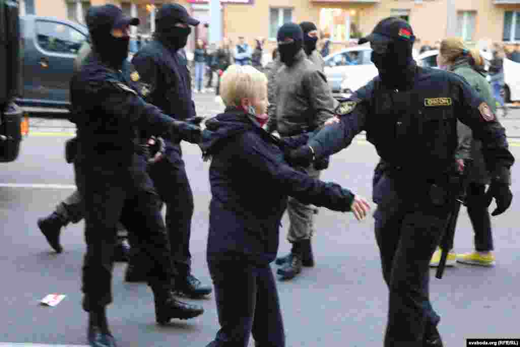 Police detain a woman following the rally in Minsk on September 8.