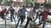 Georgian riot police clash with opposition protesters in Tbilisi in mid-June.