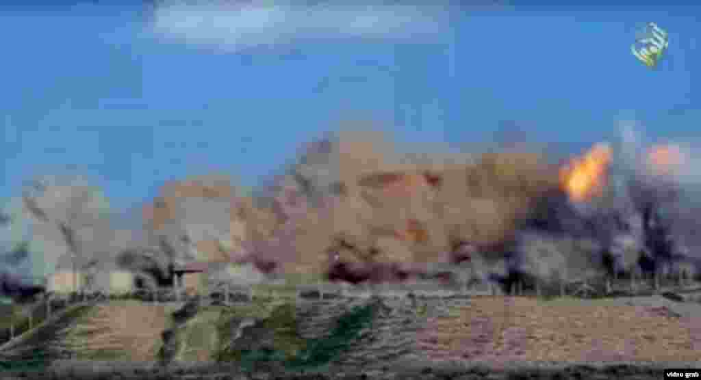 A still from video posted on social media purports to show militants' destruction of parts of Nimrud. 