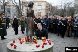 Ukrainian President Petro Poroshenko visits a monument to Holodomor victims in Kyiv in November 2016.