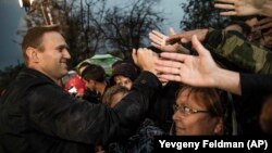 Aleksei Navalny greets supporters during an authorized rally in Astrakhan in October.