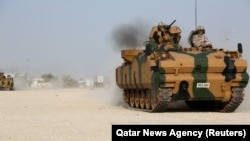 Turkish APC drives at their military base in Doha, Qatar June 18, 2017. Picture taken June 18, 2017. 