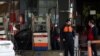 Iranians fill their cars and motorcycles at a gas station in Tehran, November 15, 2019