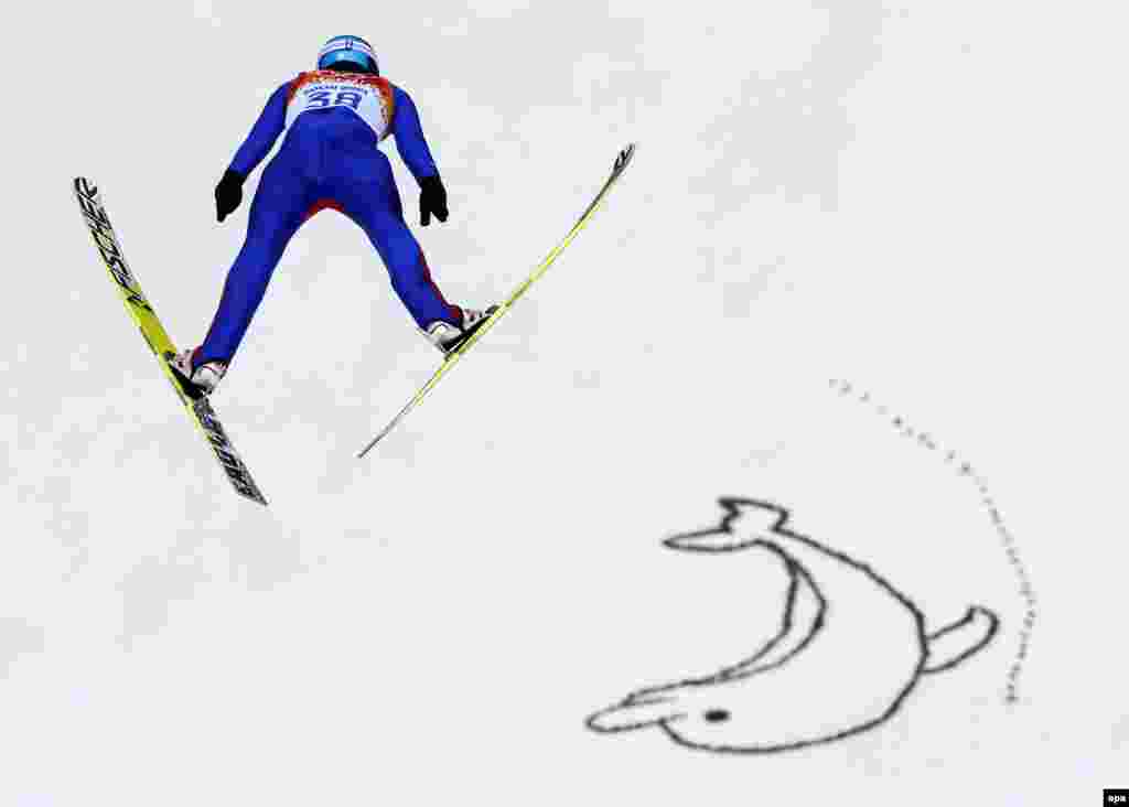 Norway's Joergen Graabak in action during the nordic combined individual LH/10-kilometer ski jumping competition. Graabak won the gold medal. (epa/Valdrin Xhemaj)