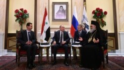 Президент Росії Володимир Путін (посередині), президент Сирії Башар Асад (ліворуч) і патріарх Антіохійський Іоанн X. Сирія, Дамаск, 7 січня 2020 року