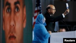 Khizr Khan, whose son Humayun was killed fighting for the U.S. in Iraq, speaks to the Democratic National Convention in Philadelphia in late July, his wife, Ghazala, standing by his side.