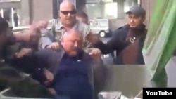 Former Cossack leader Oleksandr Panchenko is among many officials who have been thrown into trash containers.