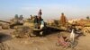 Children in Afghanistan play in a junkyard of Soviet-era tanks left over from Moscow's disastrous occupation of the country between 1979 and 1989. 