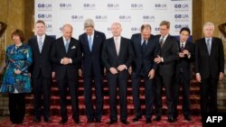 G8 foreign ministers pose for a group photograph ahead of their meeting at Lancaster House in London on April 11.