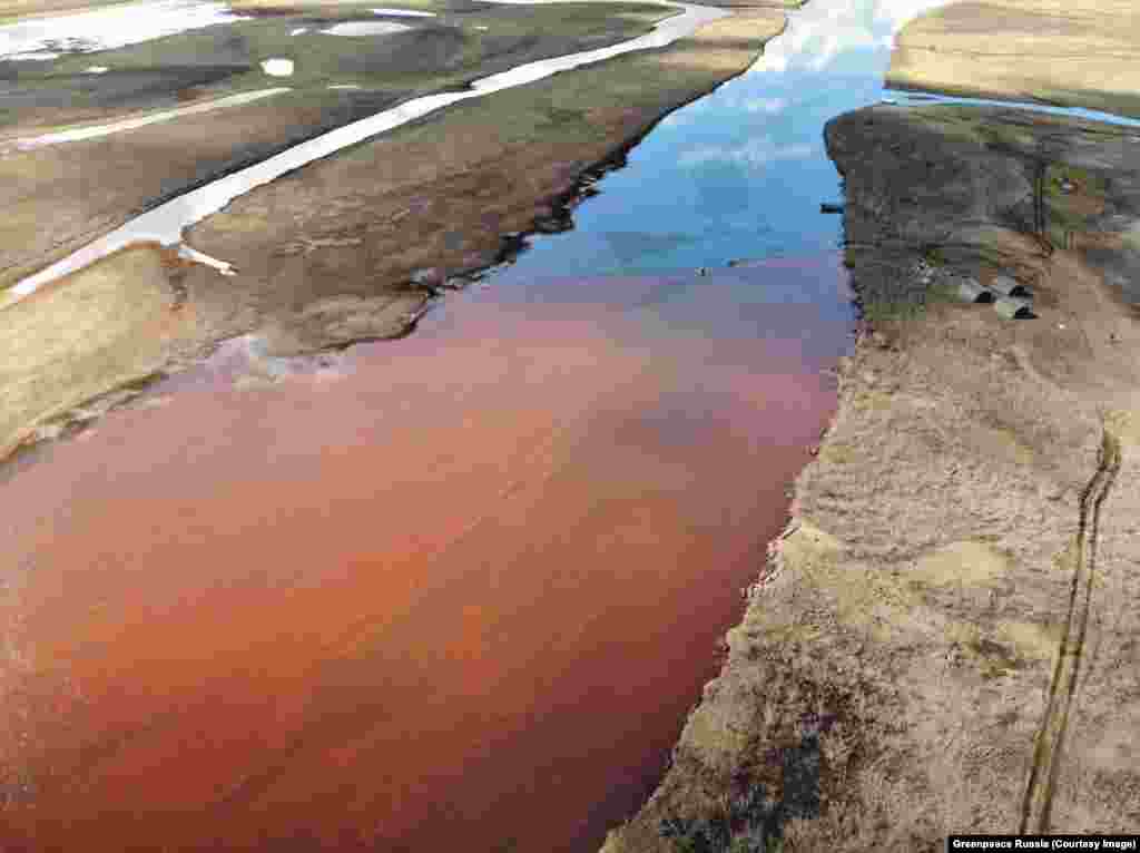 A photo issued by the environmental watchdog Greenpeace Russia showed how local rivers were colored red by the massive fuel leak.&nbsp;