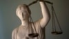 EDITORS' NOTE: Reuters and other foreign media are subject to Iranian restrictions on their ability to report, film or take pictures in Tehran. A Justice statue is pictured at the office of Masoud Shafie, lawyer for the three U.S. hikers charged with sp