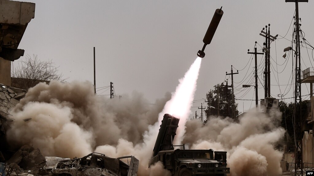 Iraqi troops fire artillery toward Islamic State positions in western Mosul on March 11.