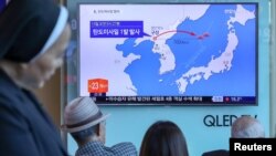 In Seoul, residents watch a news report on North Korea firing a ballistic missile.