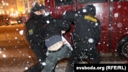 Riot police break up postelection protests in downtown Minsk on December 19.