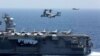 An MV-22 Osprey prepares to land on the flight deck of the USS Abraham Lincoln aircraft carrier in the Arabian Sea on May 17.