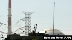 An anti aircraft battery is seen in front of the reactor building of the Bushehr nuclear power plant, February 26, 2018