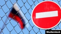 Generic – Flag of Russia behind a fence with a forbidding sign brick