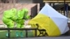 Members of the emergency services in biohazard suits place a tent over the bench where Sergei Skripal and his daughter Yulia were found unconscious after being exposed to what Britain says was the nerve agent Novichok in Salisbury, England, on March 4.