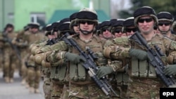 Georgian soldiers march during a farewell ceremony marking their departure to Afghanistan near Tbilisi in March.