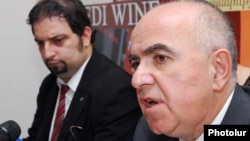 Armenia -- The head of the State Migrarion Service, Gagik Yeganian (R), at a press conference, 22Jul2010.