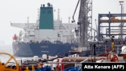 A Panamanian tanker docks at the platform of the oil facility in the Khark Island, on the shore of the Gulf, March 12, 2017