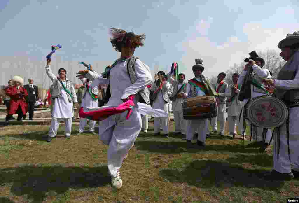Afghan artists perform the traditional "attan" dance during international Norouz celebrations in Kabul on March 27. (Reuters/Omar Sobhani)