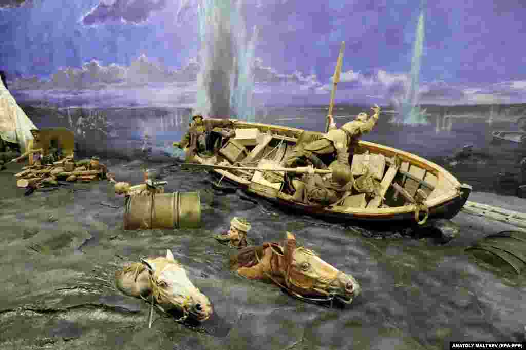 Horses gasp their way across the Dnieper River as Red Army soldiers are blasted from their boat.