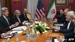 U.S. Secretary of State John Kerry (left) holds a meeting with Iran's Foreign Minister Javad Zarif (right) over Iran's nuclear program in Lausanne, Switzerland, on March 17.