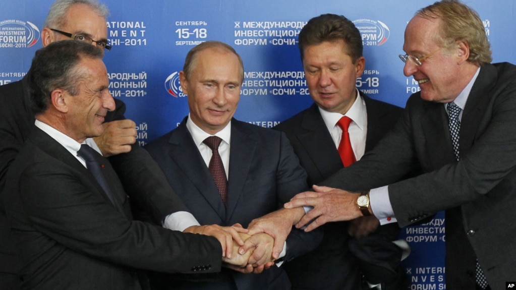 The signing of an agreement on the construction of the South Stream gas pipeline in Sochi in 2011. Rear left is Wintershall representative Harold Schwager. Russia was represented at the ceremony by then-Prime Minister Vladimir Putin (center) and Gazprom chief Aleksei Miller (second from right).