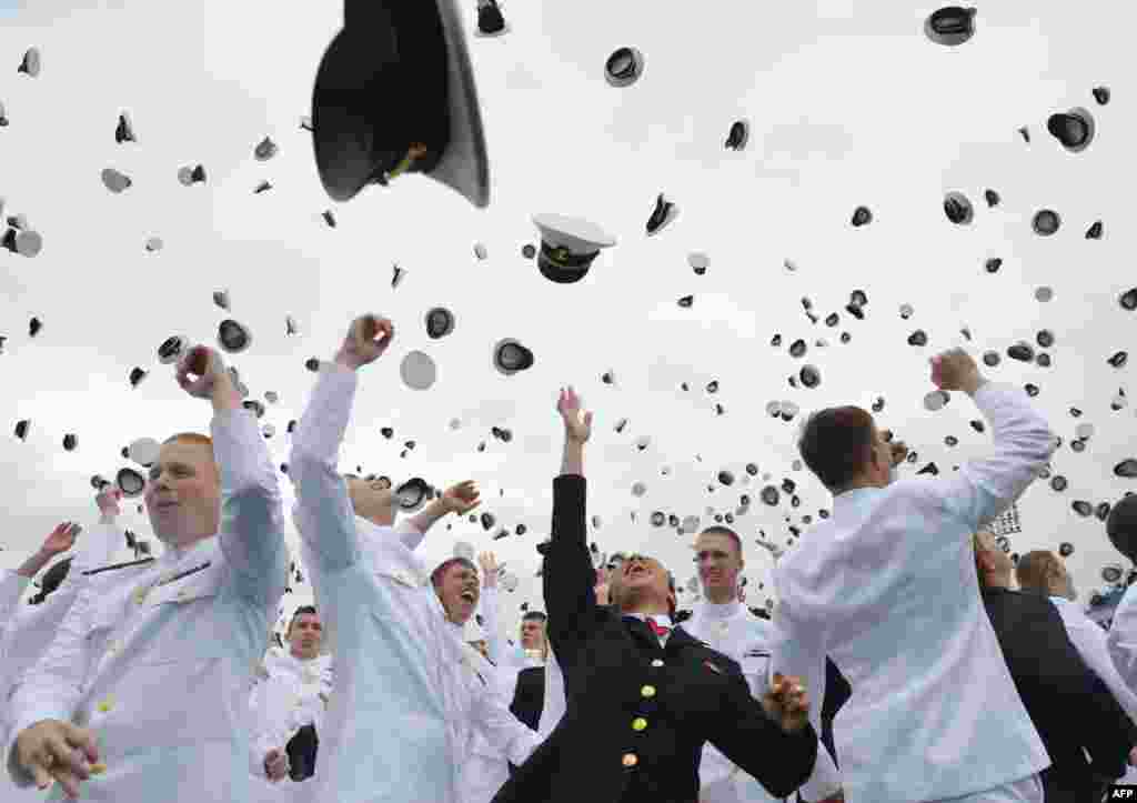 Graduates of the U.S. Naval Academy celebrate during a graduation ceremony at the Navy-Marine Corps Memorial Stadium in Maryland on May 24. (AFP/Mandel Ngan)