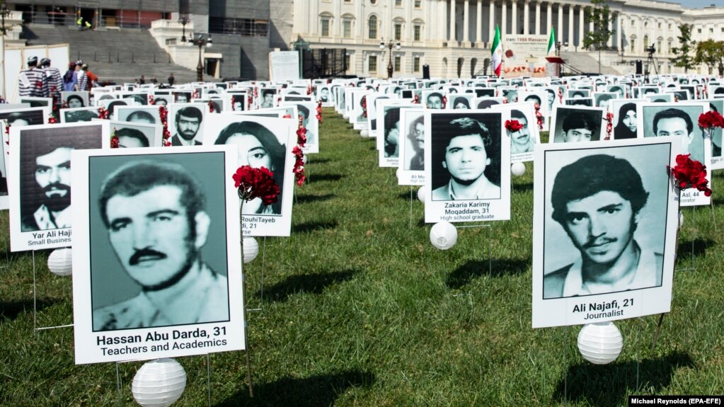 A file photo of a protest in Washington, D.C. showing images of the alleged victims of state-sponsored executions of Iranian political prisoners. 