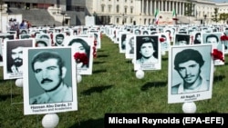 A file photo of a protest in Washington, D.C. showing images of the alleged victims of state-sponsored executions of Iranian political prisoners.