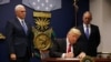 U.S. President Donald Trump signing his temporary ban on refugees earlier this year