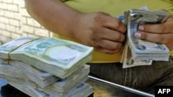 A stack of currency at a stall in central Baghdad's Fardus Square (file photo)