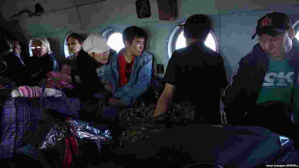 People in a helicopter, near Billings village, Chukotka