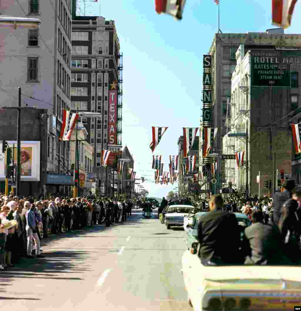 Crowds line Main Street in Dallas for the presidential motorcade as it approaches Dealey Plaza, where the assassination took place.