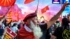 Macedonian protesters wave flags in front of the parliament building in Skopje during a demonstration earlier this year against a proposed change in the name of the country. Some analysts fear a "fake news" campaign could affect the outcome of an upcoming referendum on the issue. 